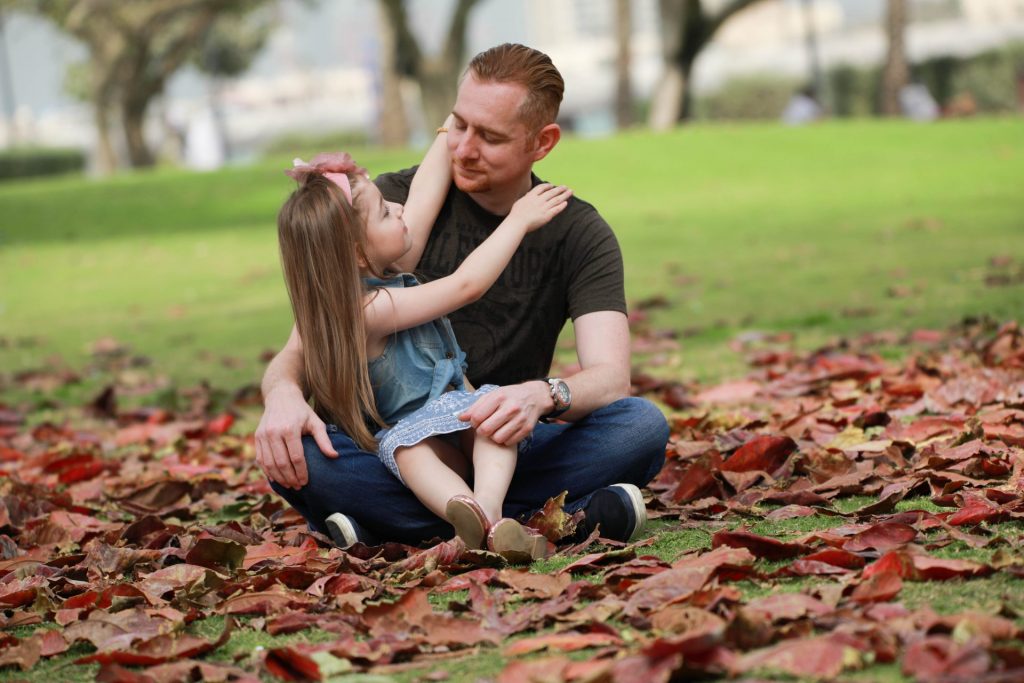 father and daughter smiling during a family photography session in Dubai
