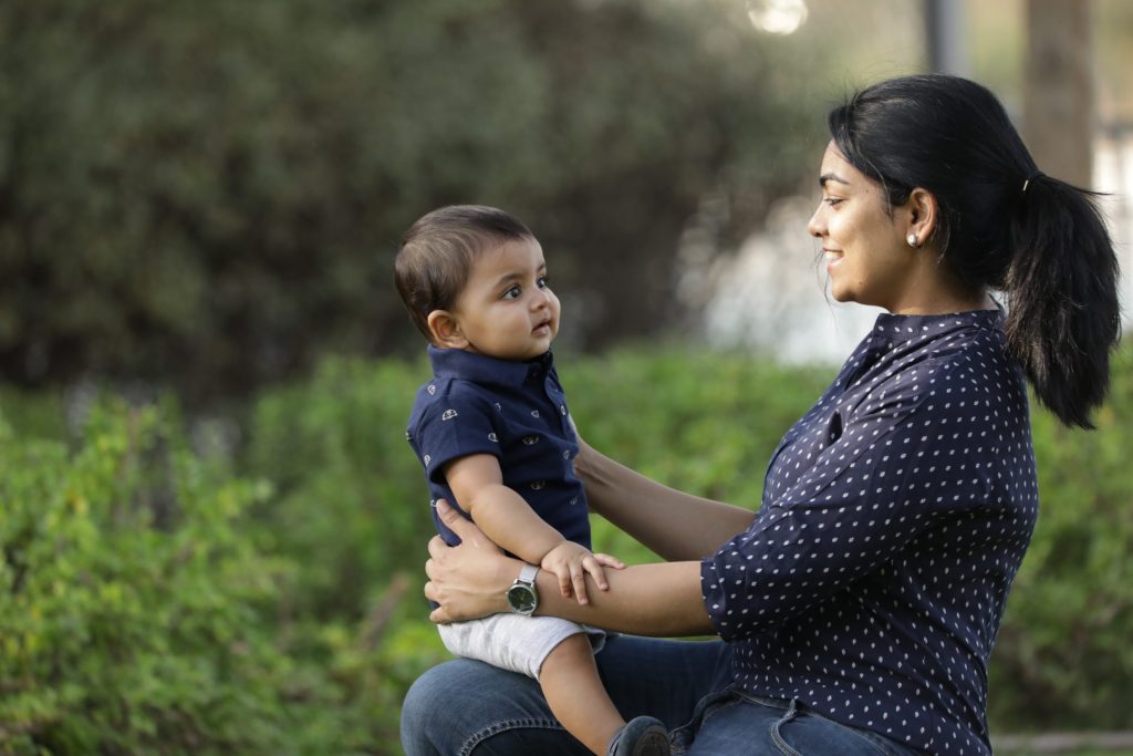 Mother and son having a park day during a family photography session in Dubai