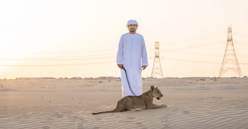 Fashion photographer in Dubai captures stylish citizen in elegant white gown