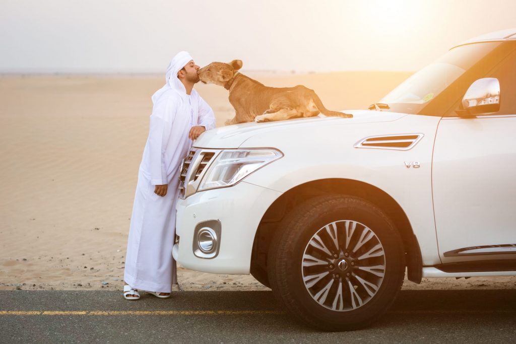 Arabic man with his pet, shot by Dubai's top fashion photographer.