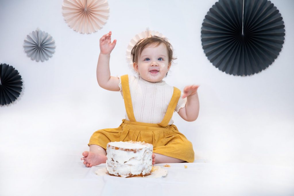 Small kids enjoying an birthday treat in Dubai in kids photography in Dubai